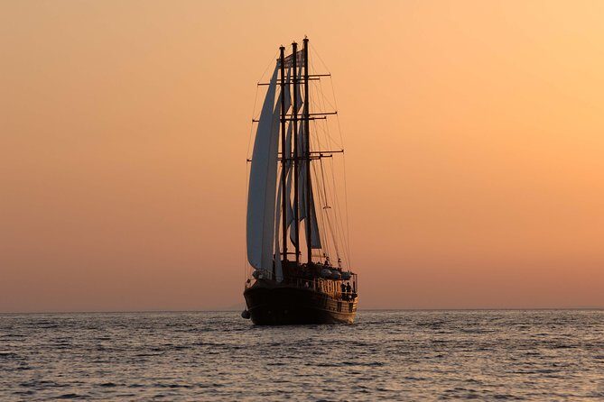 Santorini Caldera Sunset Sailing Cruise with Dinner and Wine - Dinner on board in Thirassia Bay: Greek buffet plus included wine