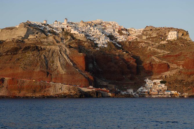Santorini Caldera Sunset Sailing Cruise with Dinner and Wine - Pickup, meeting point, and why the start matters