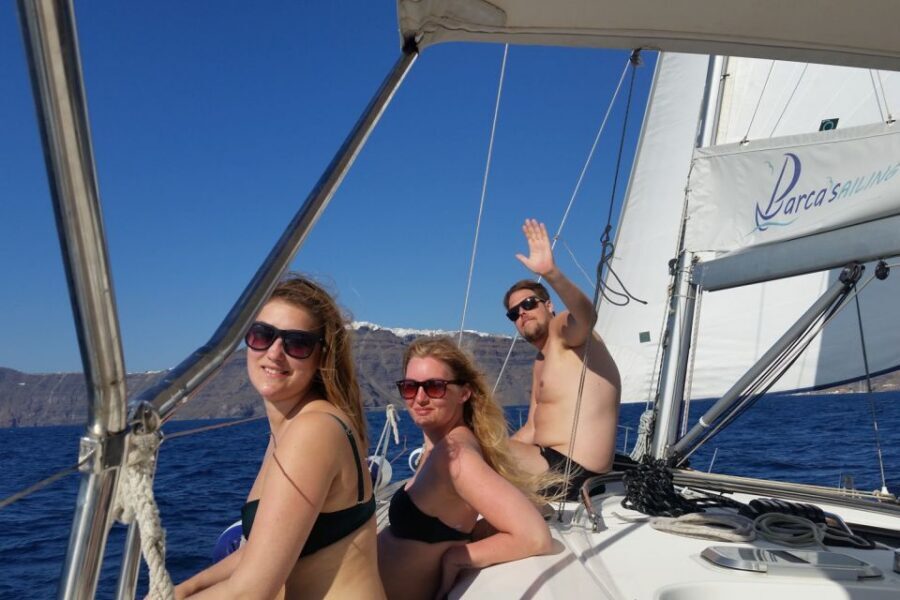 Santorini Caldera: Sunset Sailing Cruise with Meal - Indian Rock, Akrotiri lighthouse views, and sailing into the caldera
