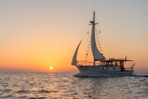Santorini Caldera Sunset Traditional Cruise with Meal and Drinks - Thirassia swim and snorkel: fishermen’s island + lunch onboard