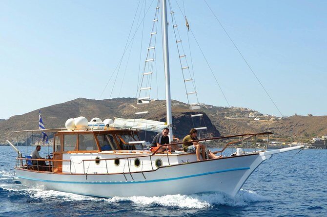 Santorini Caldera Sunset Traditional Cruise with Meal and Drinks - White Beach by boat: private-feeling water color