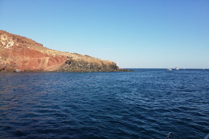 Santorini Catamaran Cruise with Fresh Meal and Open Bar - The cruise route: Red and White Beaches, then the volcanic core