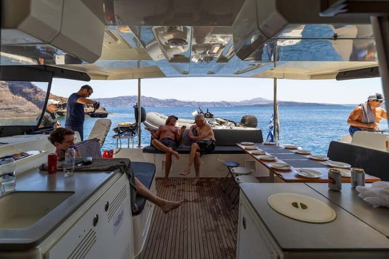 Santorini: Catamaran Cruise with Fresh Meal & Open Bar - Akrotiri Lighthouse stop: scenery with a swimming option