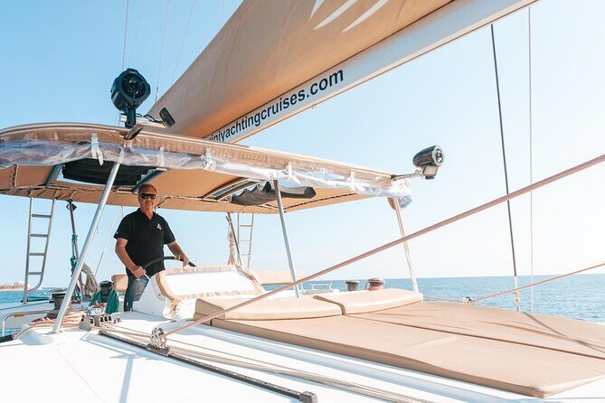 Santorini Catamaran Cruise: with Lunch, BBQ, Open Bar, Transfers - Transfers, timing, and what to bring for a smoother day