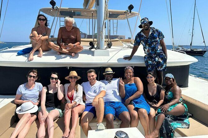 Santorini Catamaran Cruise: with Lunch, BBQ, Open Bar, Transfers - Sailing highlights: White Beach, Indian Rocks, and the Venetian Lighthouse