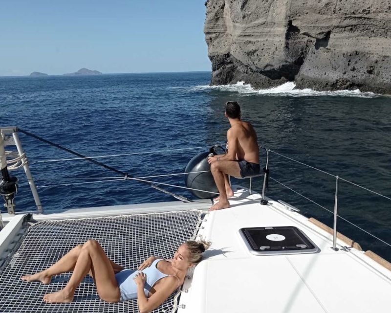 Santorini: Catamaran Cruise with Lunch, Drinks, & Oia Visit - Vlychada sunset finish: Prosecco and dessert on afternoon departures