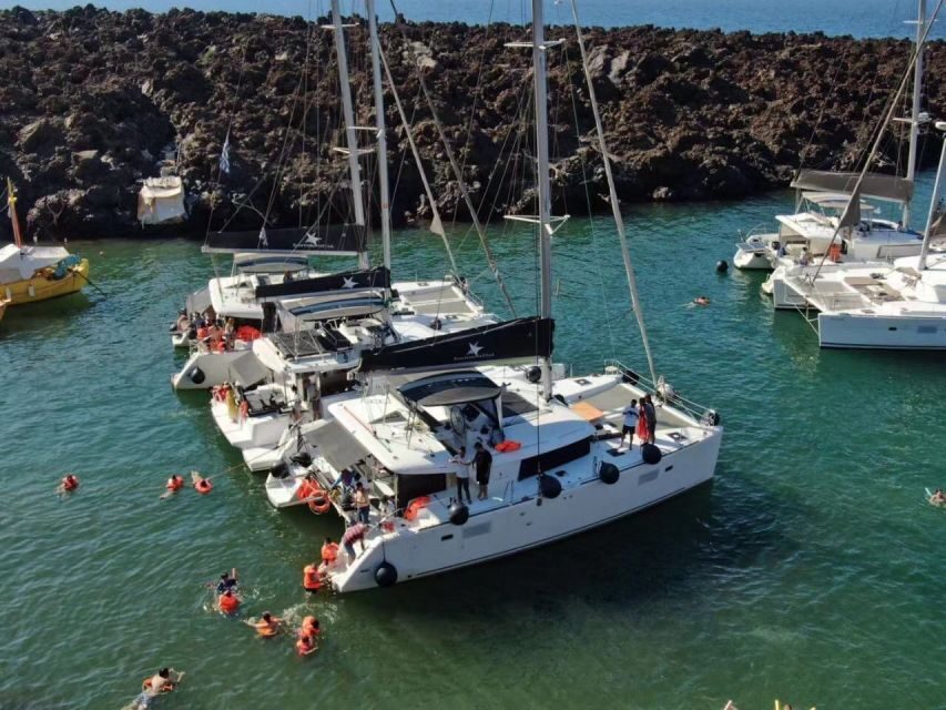 Santorini: Catamaran Cruise with Meal & Open Bar - Volcano Hot Springs: Warm Water, Volcanic Stories, and a Short Reality Check