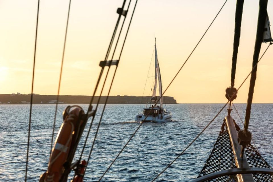 Santorini Catamaran Sunset Skyline Cruise - White Beach, Mesa Pigadia, and the southern cliffs