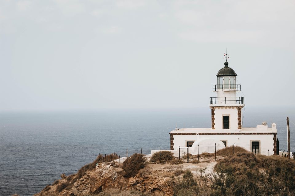Santorini Catamaran Sunset Skyline Cruise - Akrotiri Lighthouse and the entrance to the caldera