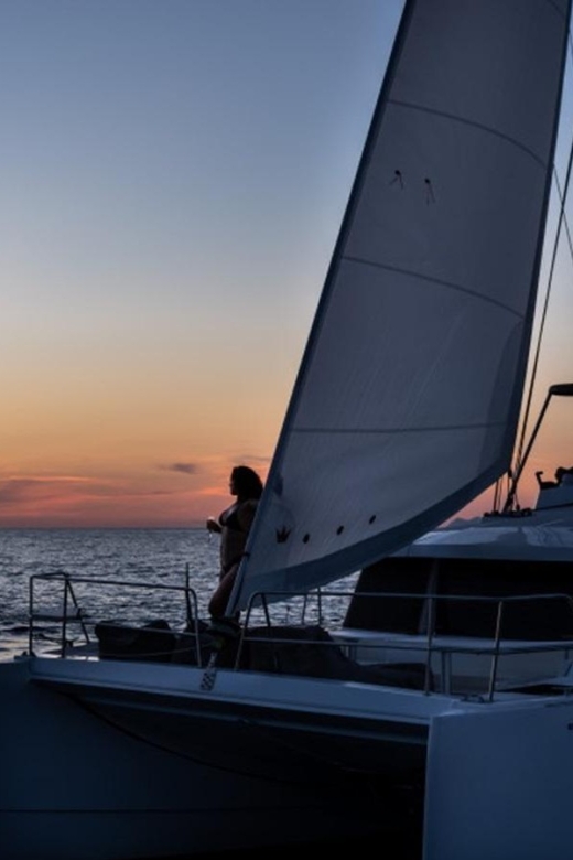Santorini Catamaran Sunset Skyline Cruise - Red Beach and the first swim
