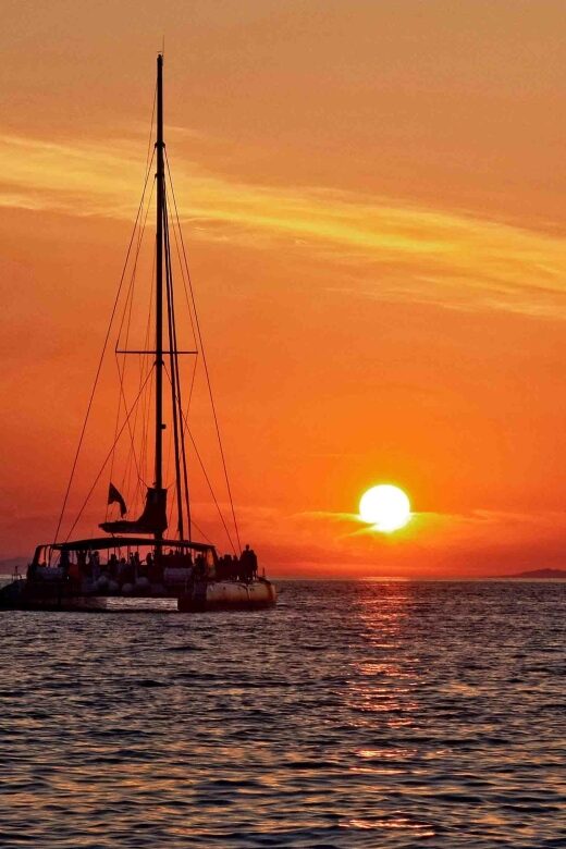 Santorini: Cruise Catamaran with BBQ & Drinks Day or Sunset - Food, drinks, and onboard comfort: value you can feel
