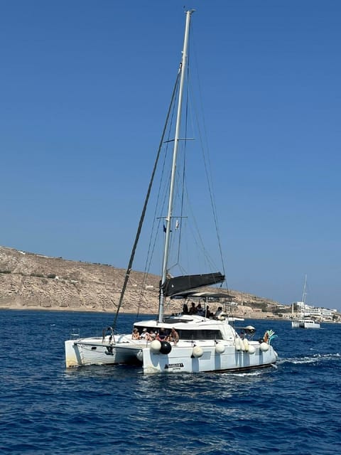 Santorini:Cruises with Catamaran around the Volcanic Island. - Red Beach and its red volcanic cliffs