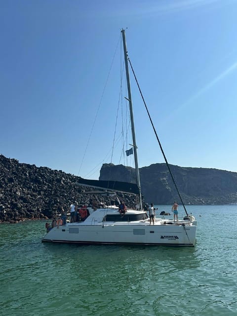 Santorini:Cruises with Catamaran around the Volcanic Island. - Mesa Pigadia and lunch on board