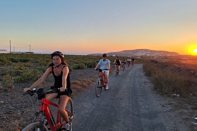 Santorini: E-Bike Sunset Tour Experience - Vineyards on the way to Megalochori