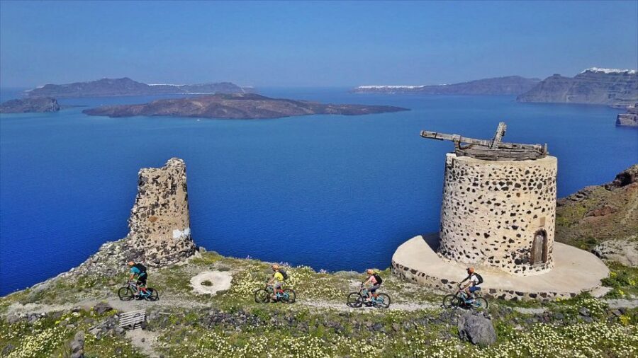 Santorini: Electric Mountain Bike Adventure - Caldera cliff views and a chapel inside volcanic ash