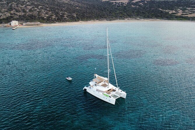 Santorini Gold Catamaran Cruise with BBQ, Drinks and Hotel Pickup - Volcano hot springs: the waters, the caves, and reality checks