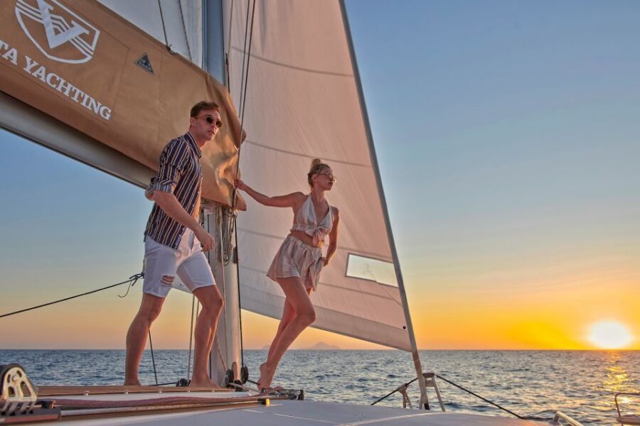 Santorini Gold Catamaran Cruise with Snorkel, BBQ & Open Bar - Onboard comfort: open bar, snorkeling gear, and the stuff you’ll use