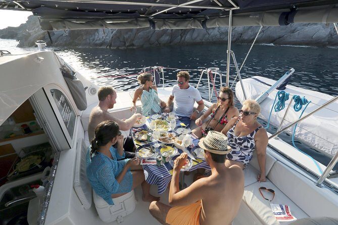 Santorini Half Day Catamaran Private Cruise incl. Meal, Drinks & Free Transport - Palia Kameni and the sulfur hot springs: what your skin will notice