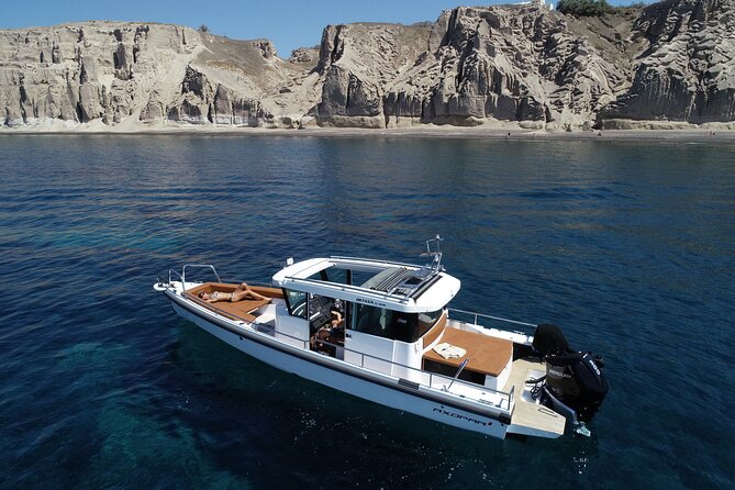 Santorini Half Day MotorCruiser Private Cruise incl. Meal,Drinks &Free Transport - Oia, Imerovigli, and Firostefani from below