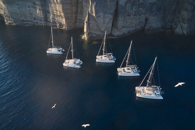 Santorini: Luxury Catamaran Cruise with Fresh Fish BBQ & Drinks - Mesa Pigadia: A Secluded Black-Sand Swim Stop
