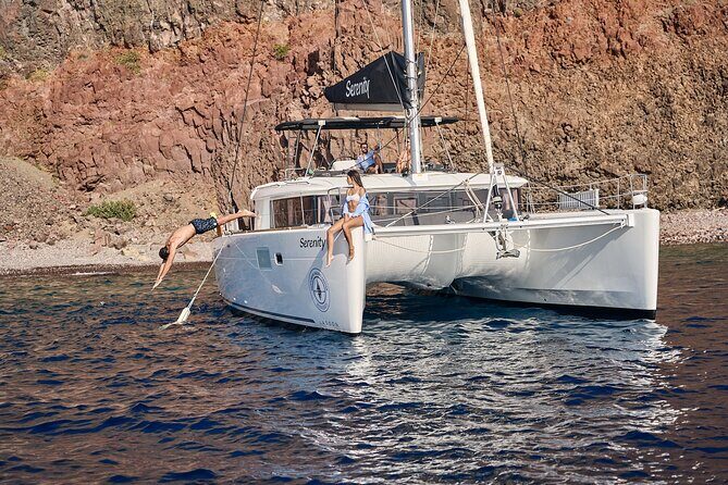 Santorini: Luxury Catamaran Cruise with Fresh Fish BBQ & Drinks - South Coast Sights: Lighthouse Views and Volcano Bay Time