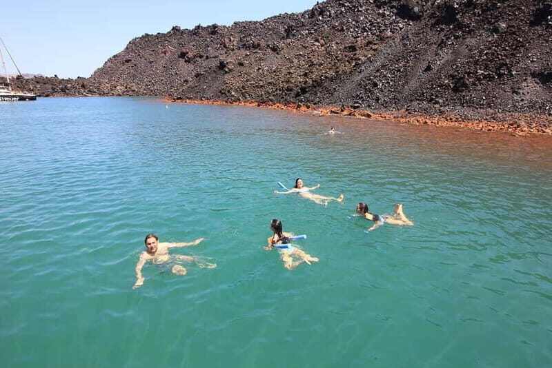 Santorini: Luxury Catamaran Cruise with Lunch, BBQ & Drinks - Palea Kameni hot springs: warm water, sulphur rules, and weather reality