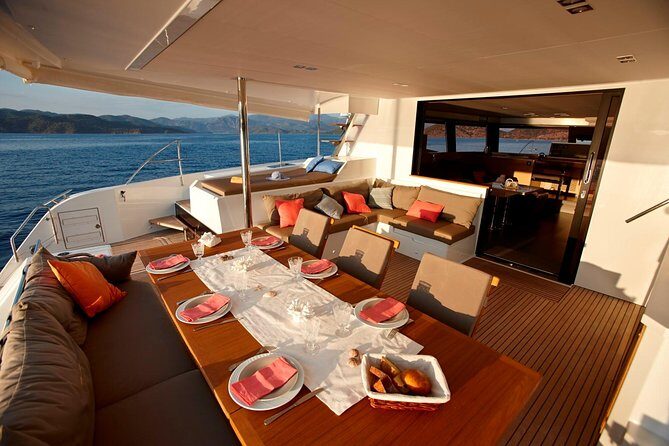 Santorini Luxury Catamaran Day Cruise with BBQ,drinks,transfer - On-board comfort: music, restroom, towels, and the stuff that keeps it easy