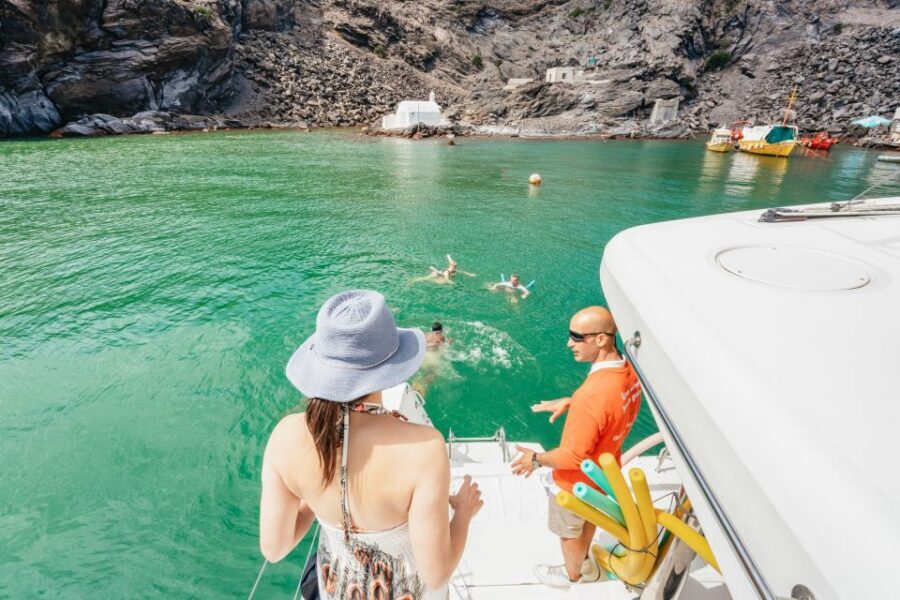 Santorini: Luxury Catamaran Day Trip with Meal and Open Bar - Sailing Views of the Caldera: Fira, Volcano Islands, and Lighthouse Shots
