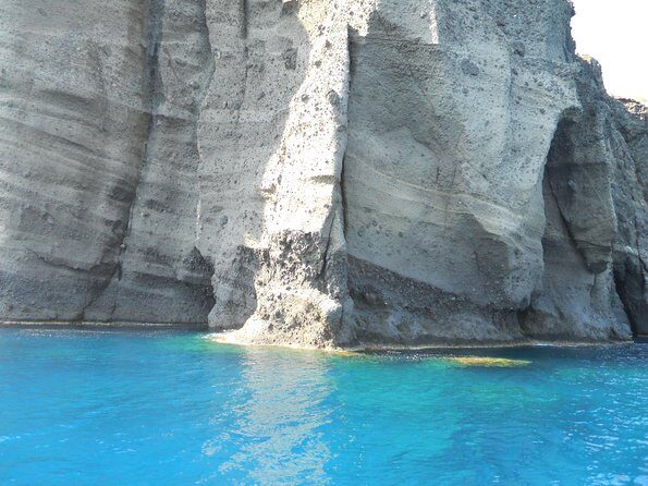 Santorini Luxury Catamaran Sunset Cruise with BBQ, Drink and Transfer - Hot Springs stop: warm mineral water, volcano proximity, and a quick swim