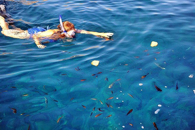 Santorini Luxury Catamaran Sunset Cruise with BBQ, Drink and Transfer - Red Beach snorkeling: short time, big color, and better expectations