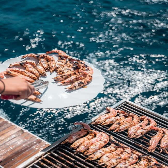 Santorini: Majestic Catamaran Cruise with Meal and Drinks - Red Beach and White Beach swims: where the colors come from