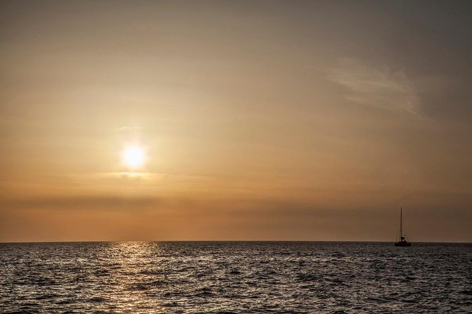 Santorini: Motor Yacht Sunset Cruise with 5-Course Dinner - Entering the caldera between the two volcanoes