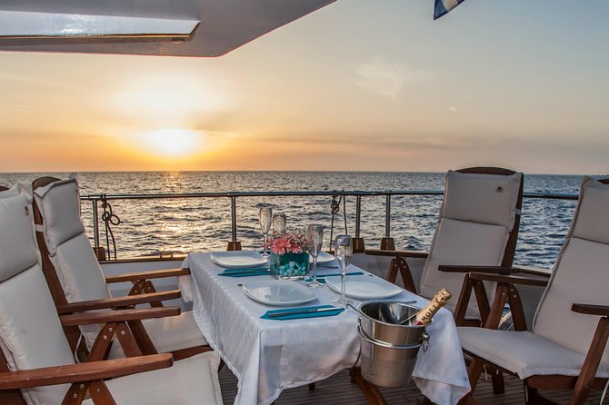 Santorini: Motor Yacht Sunset Cruise with 5-Course Dinner - Swimming at Mesa Pigadia for up to two hours