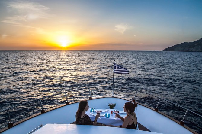 Santorini: Motor Yacht Sunset Cruise with 5-Course Dinner - Passing the red and white beaches