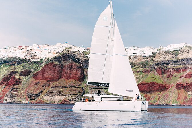 Santorini Oia: Caldera Classic Day Cruise with Snacks & Drinks - Leaving Ammoudi Bay beneath Oia
