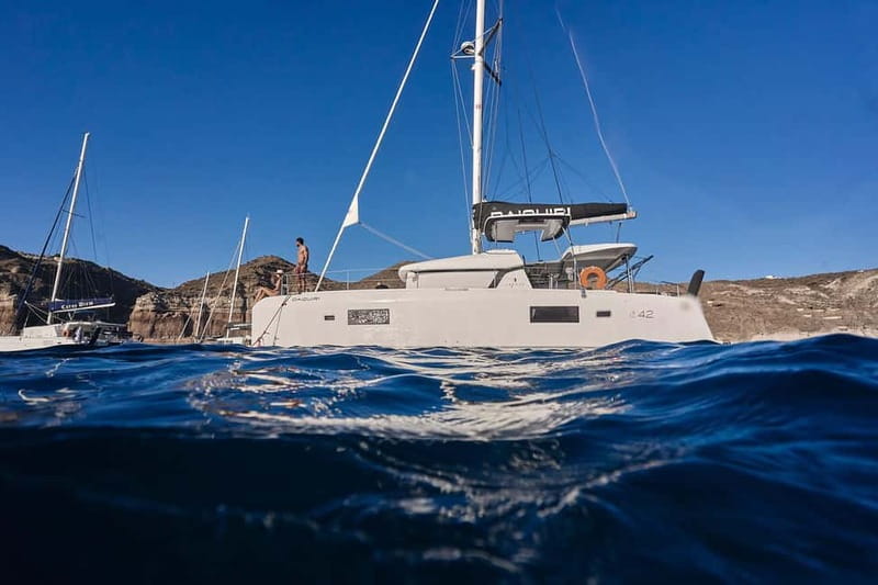Santorini Oia: Caldera Day Cruise with Snacks & Drinks - Thirassia: your first swim and local snacks