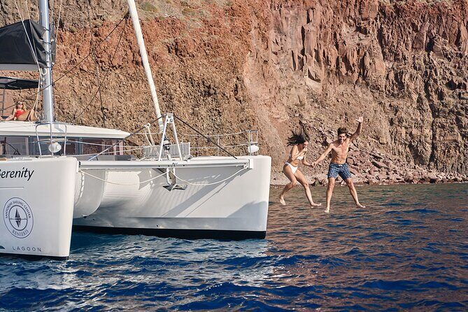 Santorini Oia: Private Sunset Catamaran Cruise with BBQ & Drinks - White Beach to Red Beach: the color shift, then the meal