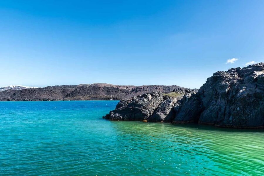 Santorini Port: 3 Hour Cruise to Volcano and Hot Springs - Nea Kameni volcano stop: crater views, self-guided pacing, and real footing