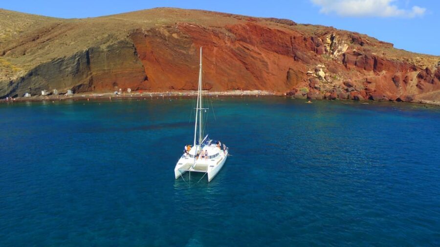 Santorini: Private Catamaran Cruise with Food & Drinks - Red Beach, White Beach, and the lighthouse angles you can’t fake