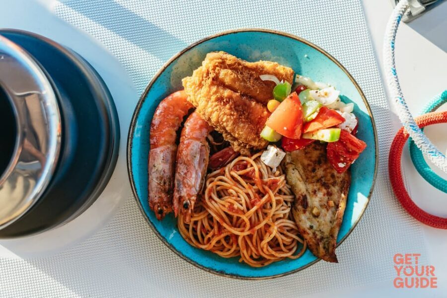 Santorini: Private Catamaran Tour with BBQ Meal and Drinks - Mesa Pigadia and snorkeling time that doesn’t feel touristy