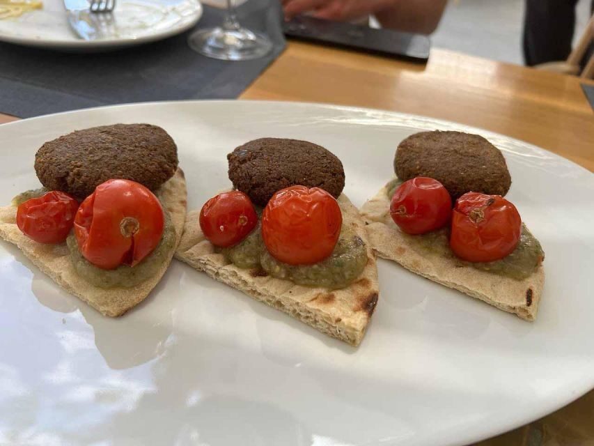 Santorini: Private Cooking Class and Wine Tasting Tour - Cooking class at a traditional Santorini restaurant: learn, chop, plate
