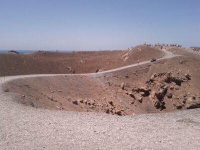 Santorini: Private Motorboat Cruise and Volcano Hike - Leaving Ammoudi Harbor below Oia