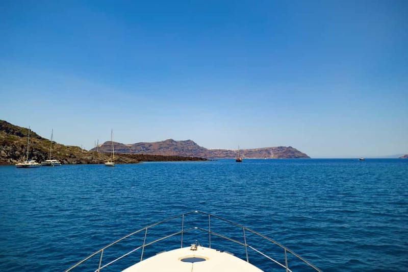 Santorini: Private Yacht Experience of Timeless Elegance - Red Beach, White Beach, and Black Mountain from the sea