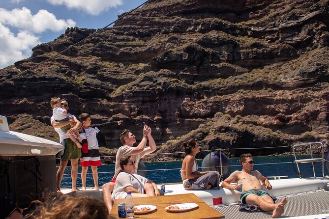 Santorini Sailing Catamaran Daily Cruises w/ Greek BBQ @Thirasia - Leaving Vlychada Marina and passing Vlychada Beach