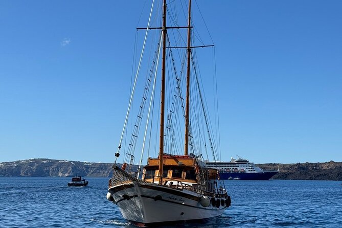 Santorini Sunset Cruise in Caldera - Sailing beneath the cliffs at sunset