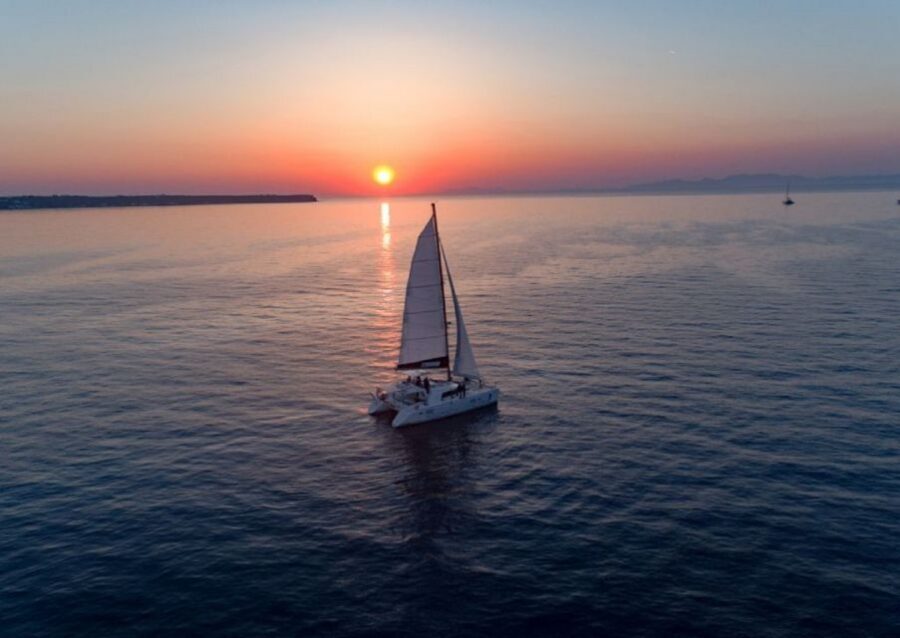 Santorini: Sunset Cruise with Swim Stops, Dinner, and Drinks - Sailing Out of Vlychada: What Makes the Start Work
