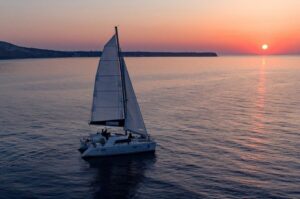 Santorini: Sunset Cruise with Swim Stops, Dinner, and Drinks - Red Beach, White Beach, and Black Mountain Beach: More Than Pretty Stops