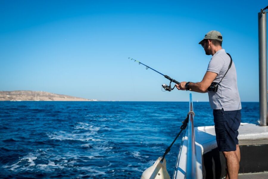 Santorini Sunset Fishing Trip with Dinner and Drinks - Traditional Music and Extra Fishing Time on the Water