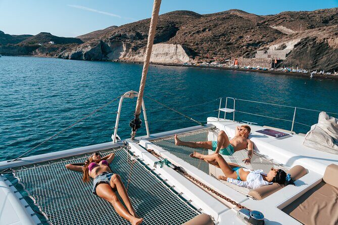 Santorini Sunset Sailing Cruise: Dinner, BBQ, Open Bar, Transfers - Mesa Pigadia Beach: swimming and snorkel plus dinner time