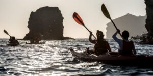 Santorini: Sunset Sea Kayak with Light Dinner - Paddling East Past White Beach and Red Beach Volcanic Color